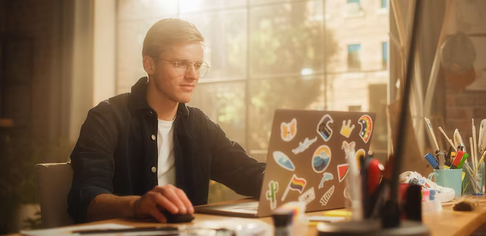 concentrated man designs video game his powerful laptop computer creative office space man looking screen creating digital clothing footwear metaverse 861143 5773